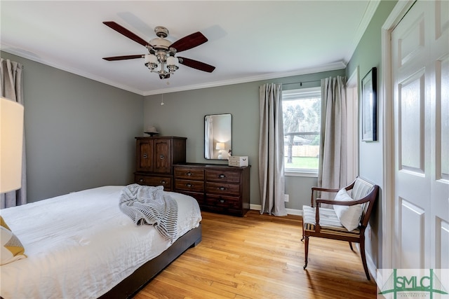 bedroom featuring light wood-type flooring, ceiling fan, and ornamental molding