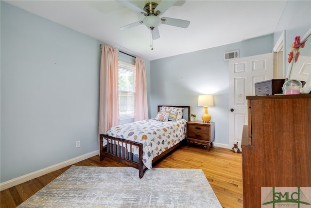 bedroom featuring wood-type flooring and ceiling fan