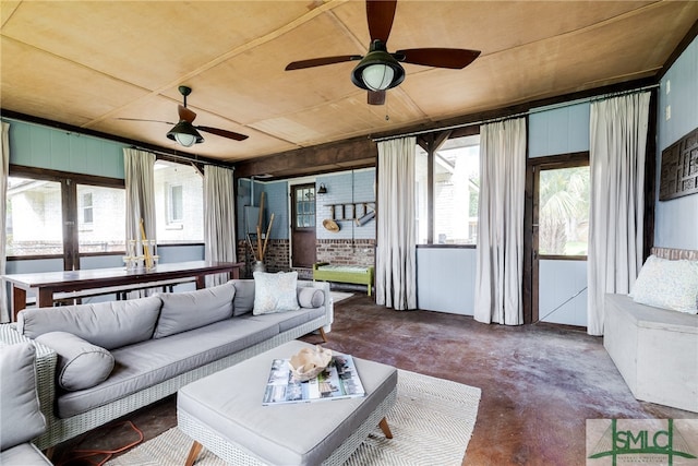 sunroom featuring ceiling fan