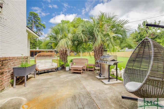 view of patio with an outdoor living space and area for grilling