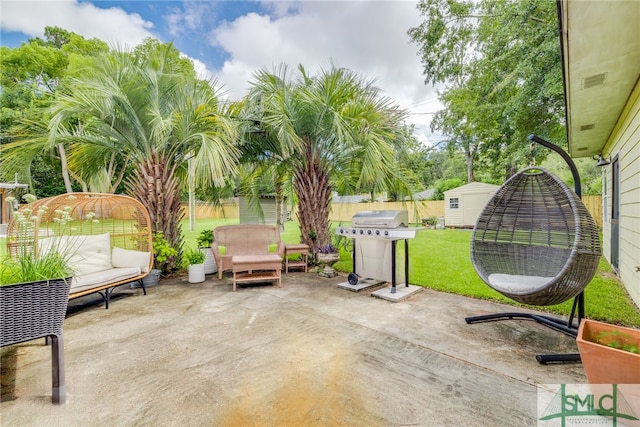 view of patio / terrace with grilling area and a storage shed