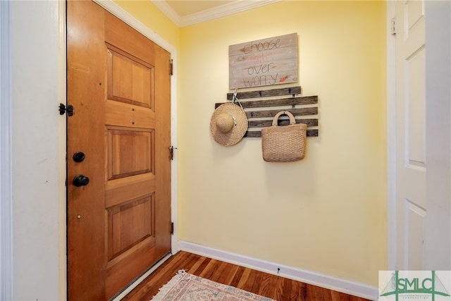 entryway featuring wood-type flooring and ornamental molding