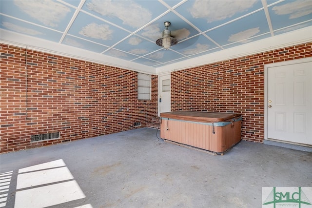 view of patio / terrace with a hot tub