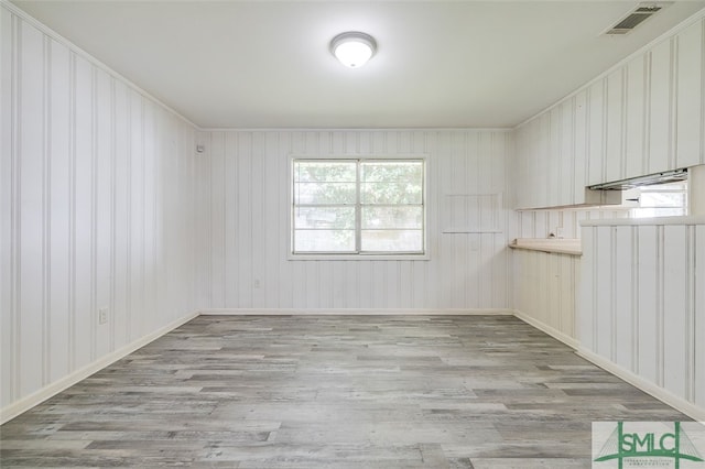 unfurnished room with light hardwood / wood-style floors