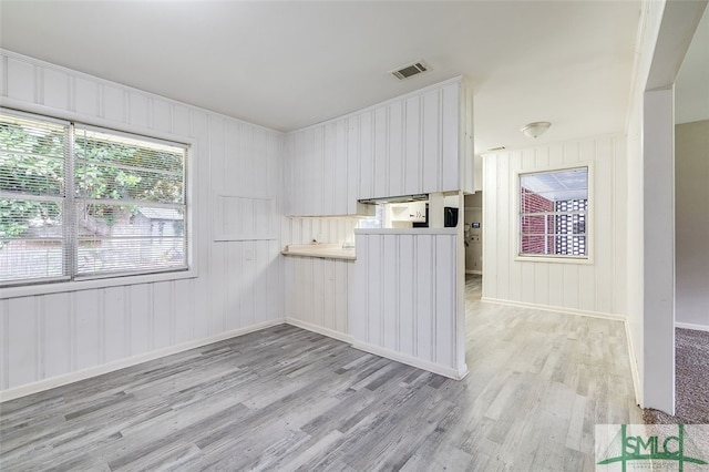 spare room featuring light hardwood / wood-style floors