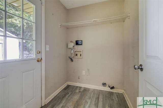 laundry room featuring washer hookup, baseboards, laundry area, and wood finished floors
