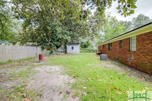 view of yard featuring central AC, an outdoor structure, fence, and a storage unit