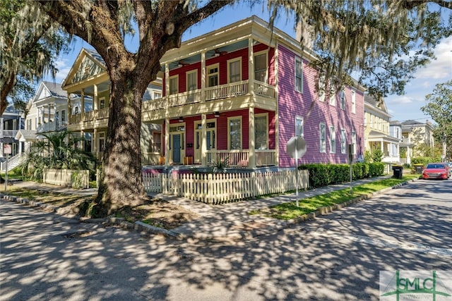 view of front facade featuring covered porch and a balcony