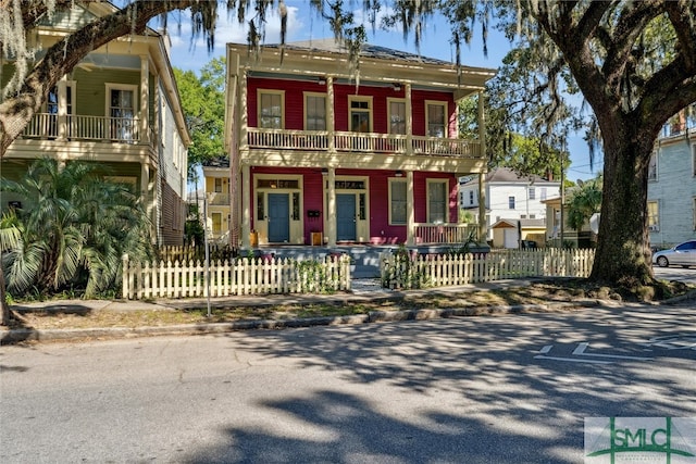 view of front facade featuring a balcony and covered porch