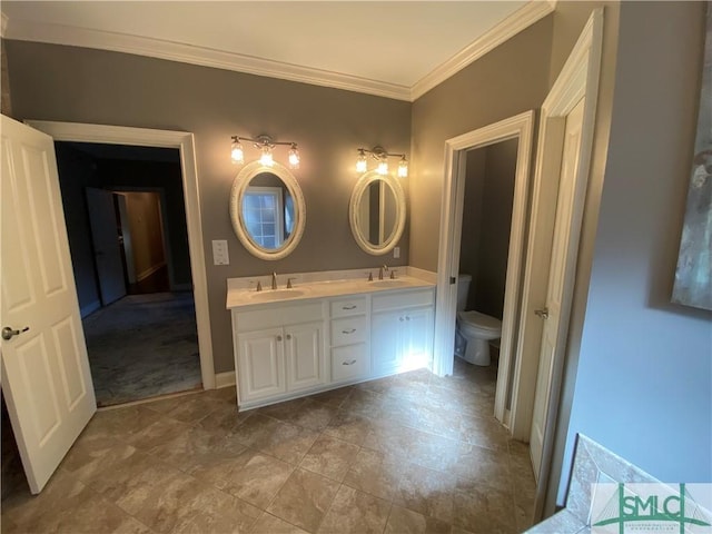 full bathroom with toilet, a sink, crown molding, and double vanity