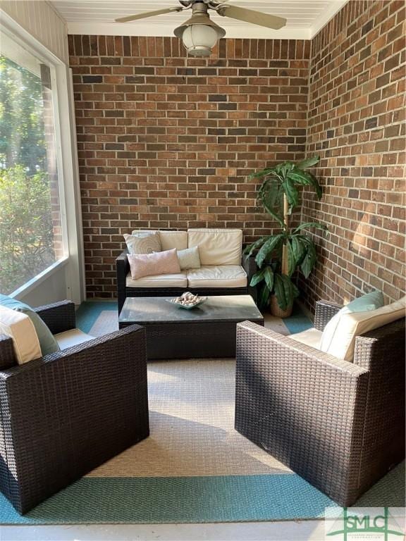 sunroom with an outdoor living space and ceiling fan