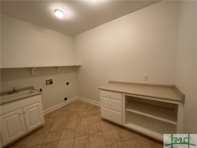 washroom with baseboards, a sink, light tile patterned flooring, electric dryer hookup, and washer hookup