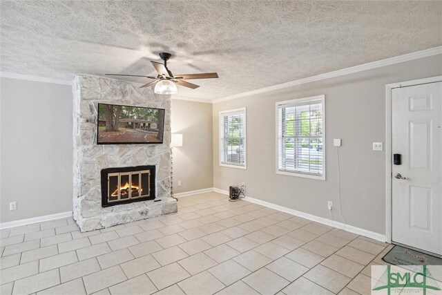 unfurnished living room with a fireplace, crown molding, light tile patterned flooring, ceiling fan, and a textured ceiling