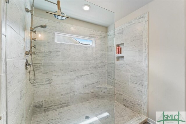 bathroom featuring tiled shower