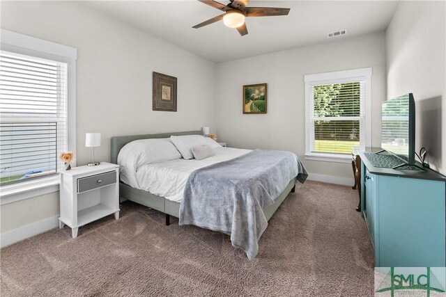 carpeted bedroom with ceiling fan