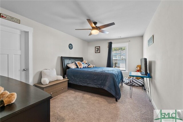 carpeted bedroom featuring ceiling fan