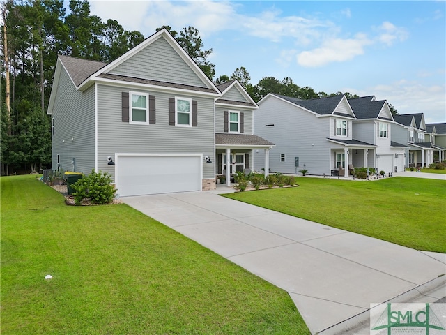 view of front of house featuring a garage and a front lawn