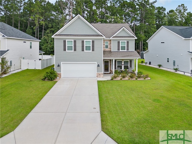 view of front facade with a garage and a front yard