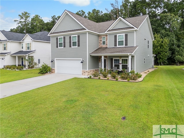 view of front of home with a garage and a front yard