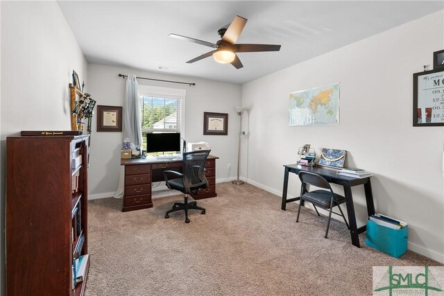 home office featuring light colored carpet and ceiling fan