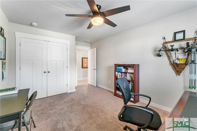 office space featuring ceiling fan and carpet