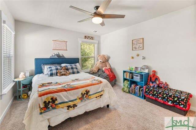 bedroom featuring ceiling fan and carpet