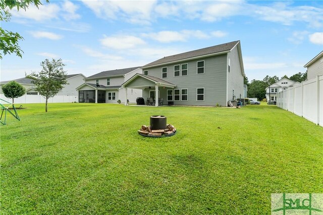 back of house with a yard