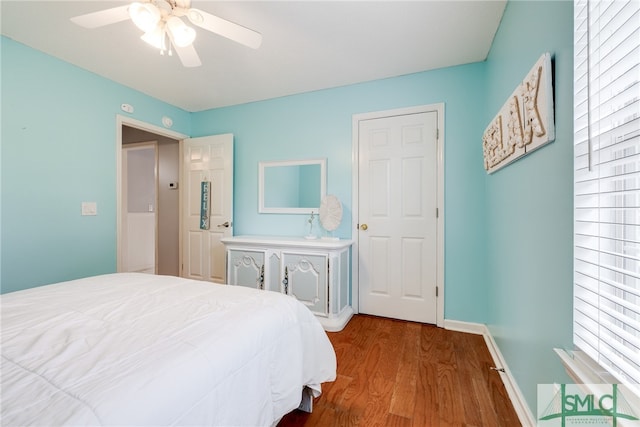 bedroom featuring wood-type flooring and ceiling fan