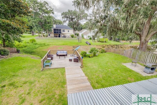 view of yard featuring outdoor lounge area and a deck