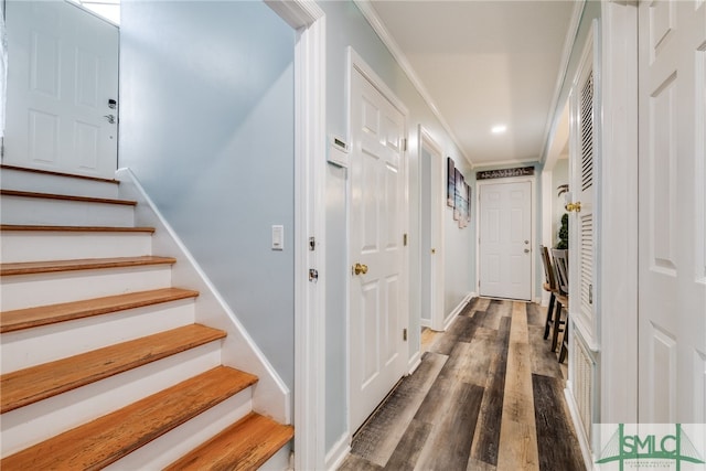 corridor featuring hardwood / wood-style flooring and ornamental molding