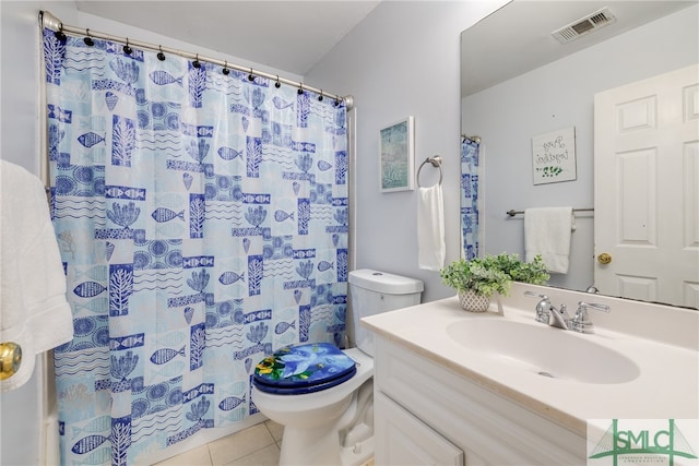 bathroom featuring a shower with shower curtain, vanity, toilet, and tile patterned floors