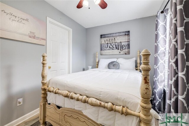 bedroom with hardwood / wood-style flooring and ceiling fan