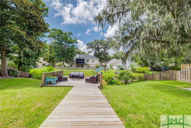 back of house with a lawn and outdoor lounge area