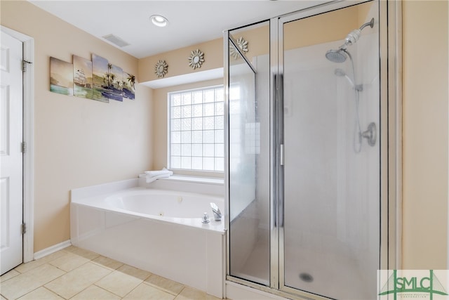 bathroom with tile patterned floors and plus walk in shower