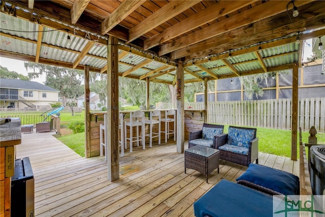 wooden terrace featuring an outdoor hangout area