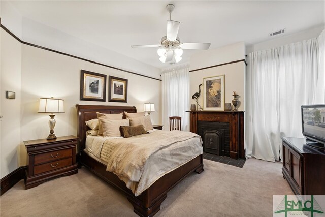 bedroom with ceiling fan and carpet floors