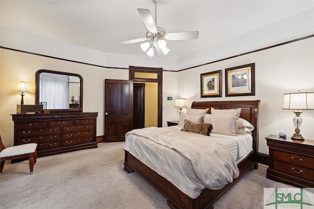 bedroom with light colored carpet and ceiling fan