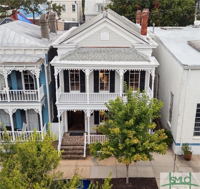 view of front of home featuring a balcony and a porch