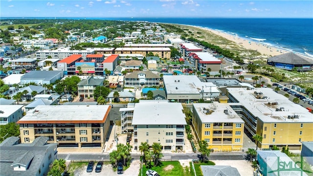 drone / aerial view featuring a beach view and a water view