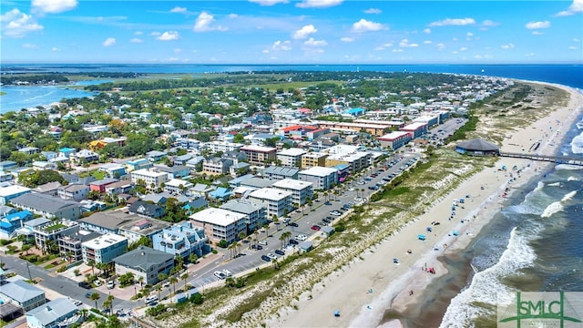 aerial view featuring a view of the beach and a water view