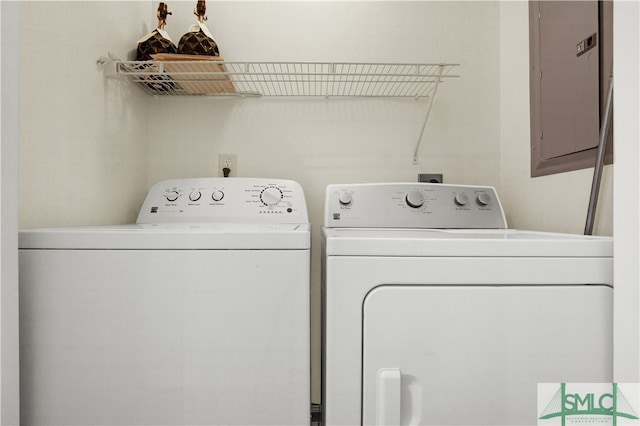 washroom with independent washer and dryer and electric panel