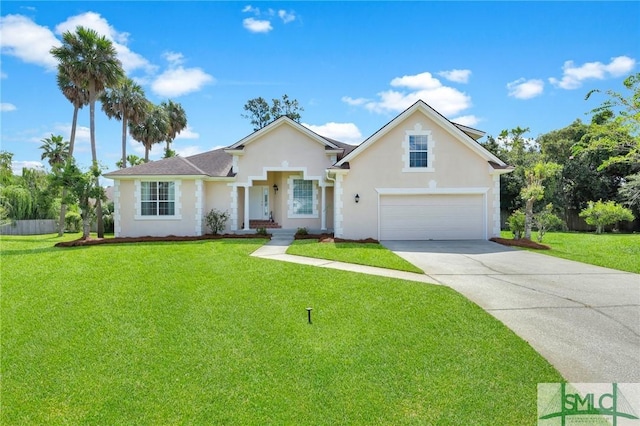 traditional home featuring concrete driveway, an attached garage, a front lawn, and stucco siding