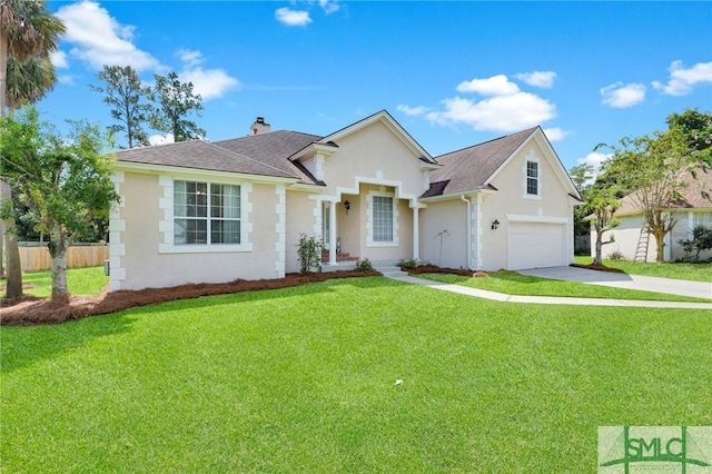 view of front of home featuring an attached garage, fence, concrete driveway, stucco siding, and a front yard