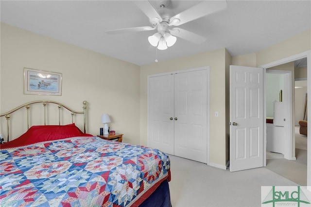 carpeted bedroom featuring ceiling fan and a closet