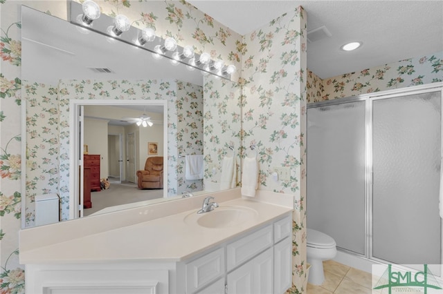 bathroom with an enclosed shower, tile patterned floors, toilet, ceiling fan, and vanity