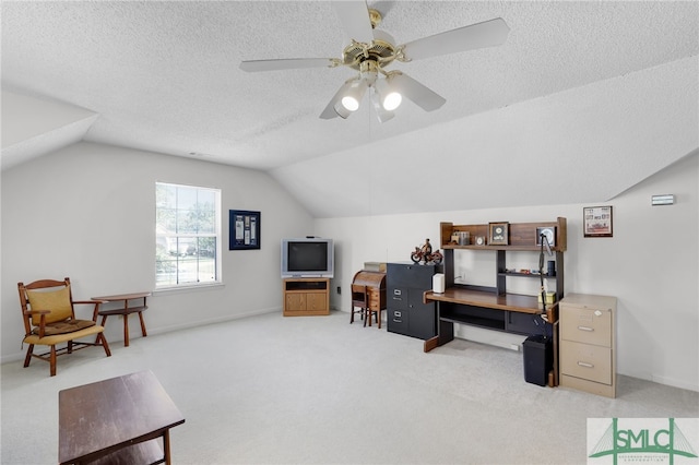 office featuring a textured ceiling, ceiling fan, carpet floors, and lofted ceiling