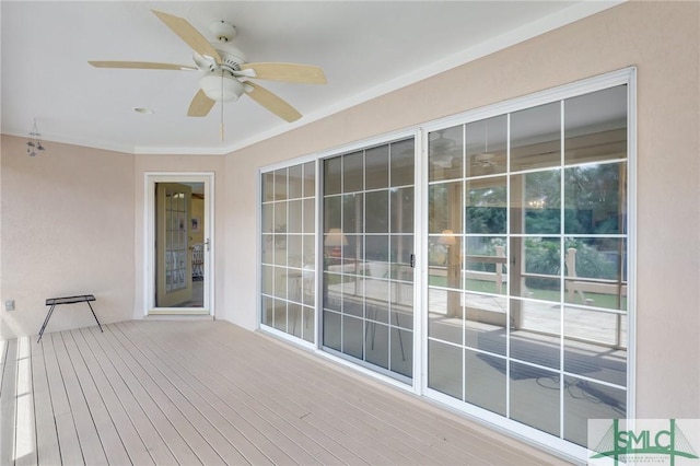 wooden terrace featuring ceiling fan