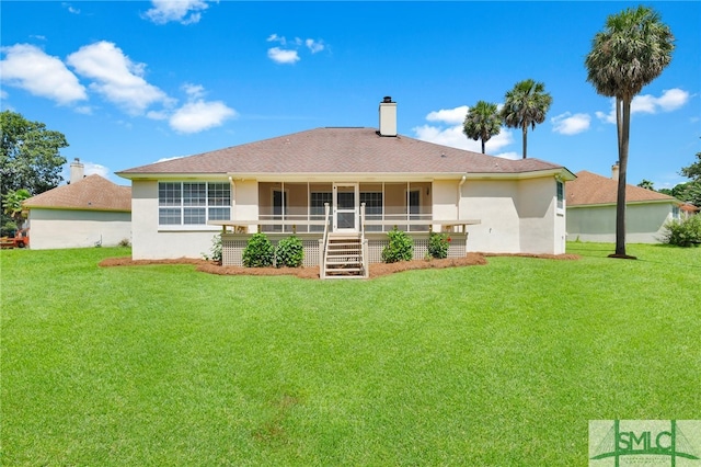 back of house with a lawn and a porch