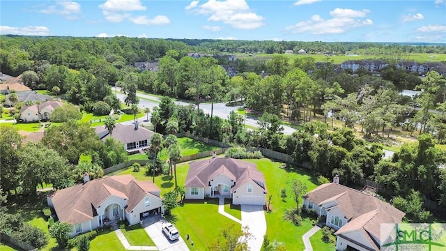 birds eye view of property with a residential view