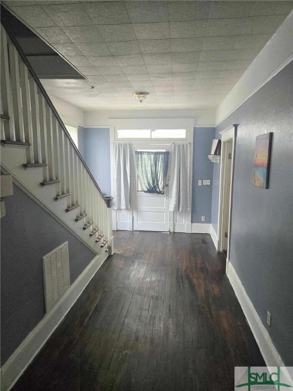 corridor with dark wood-type flooring